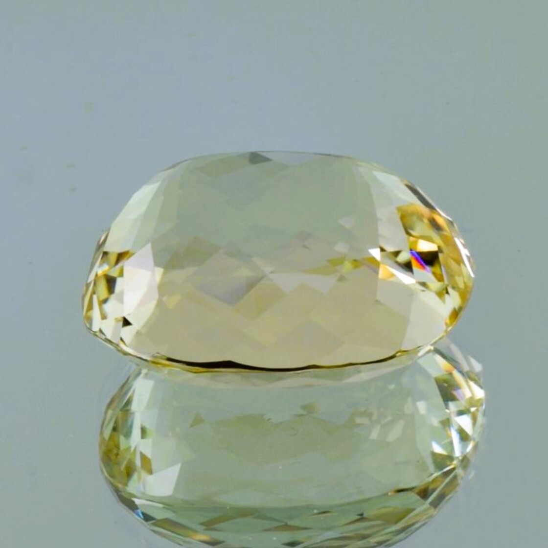 Hiddenit Spodumene cushion light yellow 134.45 ct.