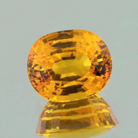 Sapphire oval intense yellow orange 6.40 ct