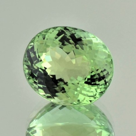 Tourmaline oval yellowish green 26.31 ct.